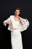 White Ancient Top by Acaria Studio featuring a relaxed fit and intricate detailing, shown on a model.