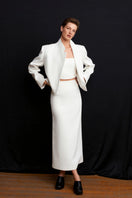 White Ancient Top by Acaria Studio, showcasing a stylish, flowy design with intricate details and a relaxed fit.