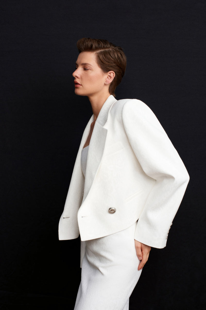 White Ancient Crop Blazer by Acaria Studio, stylish jacket with structured design and modern fit, shown on a model.