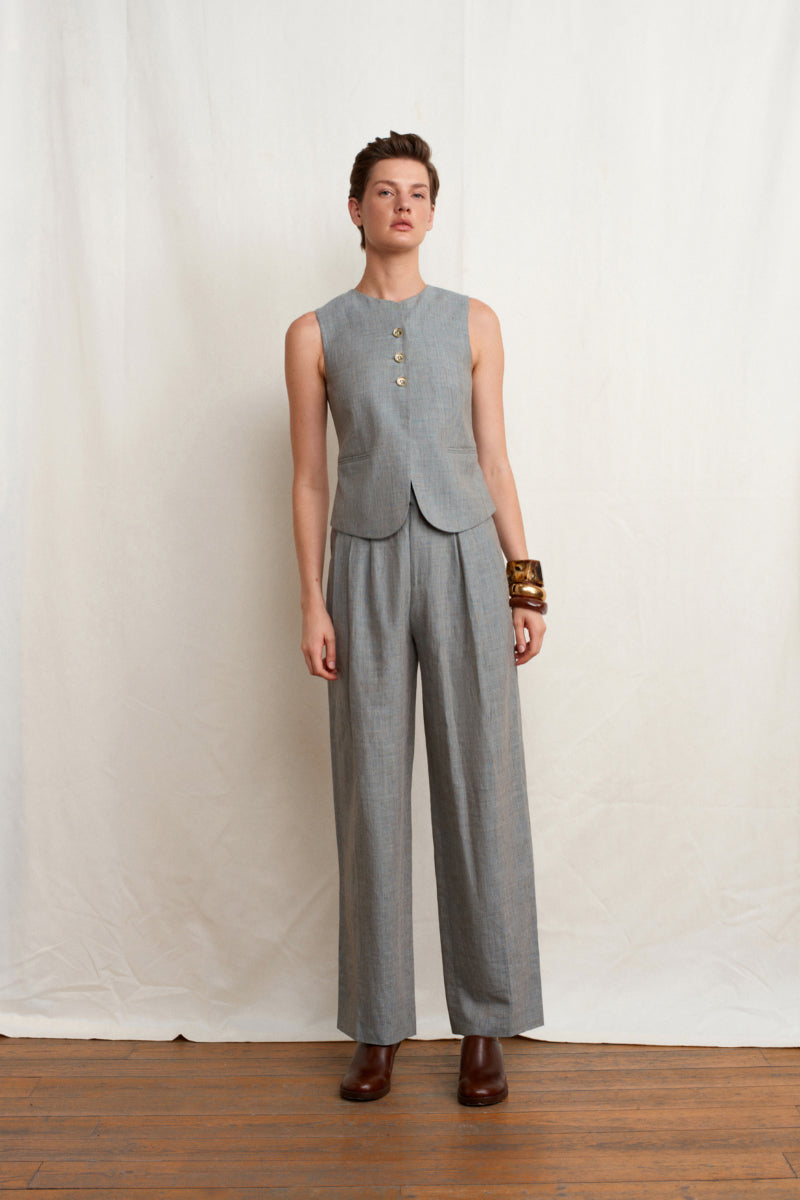 Green melange linen vest by Acaria Studio from L'Ocean collection, featuring a stylish sleeveless design and textured fabric.