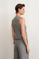 Green melange linen vest by Acaria Studio featuring a stylish, lightweight design perfect for casual or layered outfits.