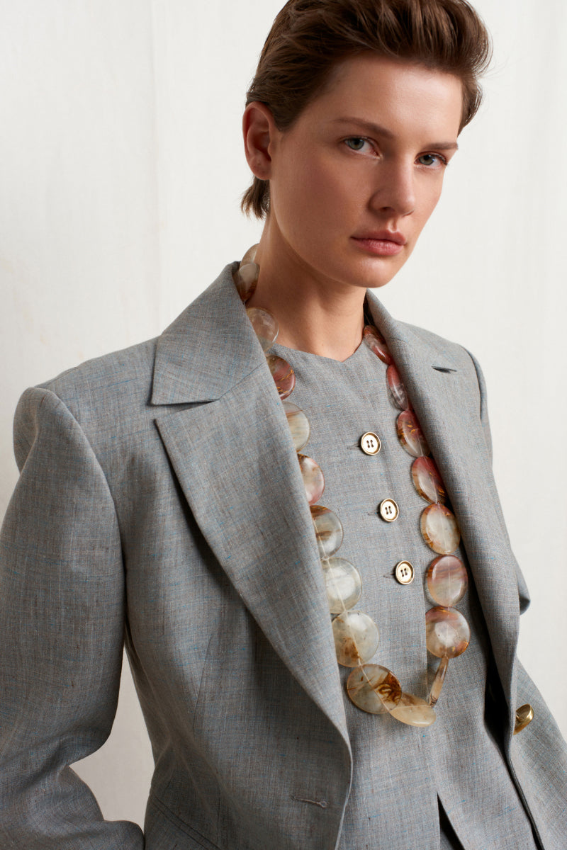 Green melange linen blazer by Acaria Studio, stylish jacket with tailored fit and classic lapel design.