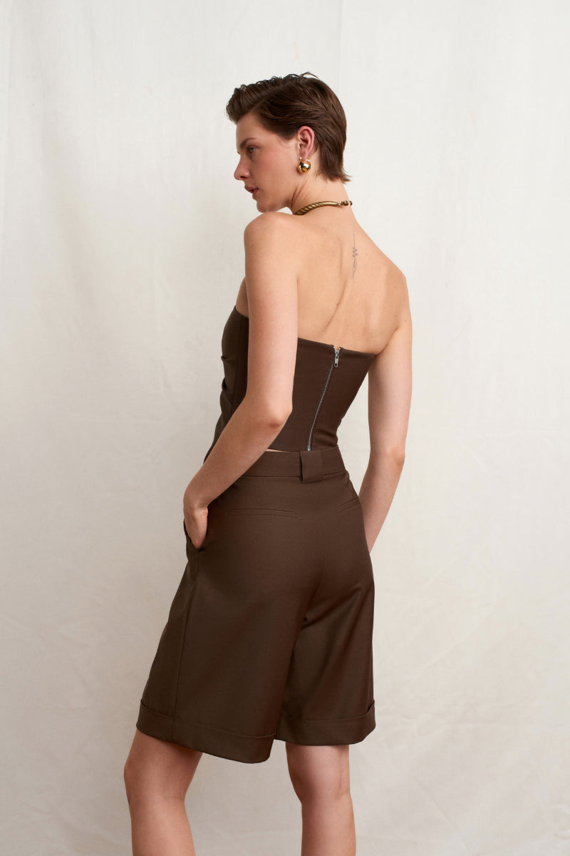 Brown Acaria Studio Guru Top, stylish women's sleeveless blouse with a relaxed fit, shown in a casual fashion pose.