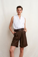 White Dahlia top by Acaria Studio featuring a stylish design, displayed on a mannequin or flat lay.