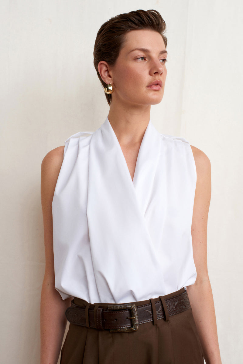 White Dahlia top by Acaria Studio featuring a stylish, fitted design perfect for casual or dressy occasions.