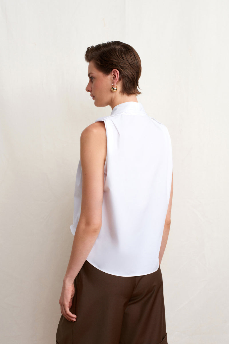 White Dahlia top by Acaria Studio featuring a stylish, fitted design perfect for casual or dressy occasions.