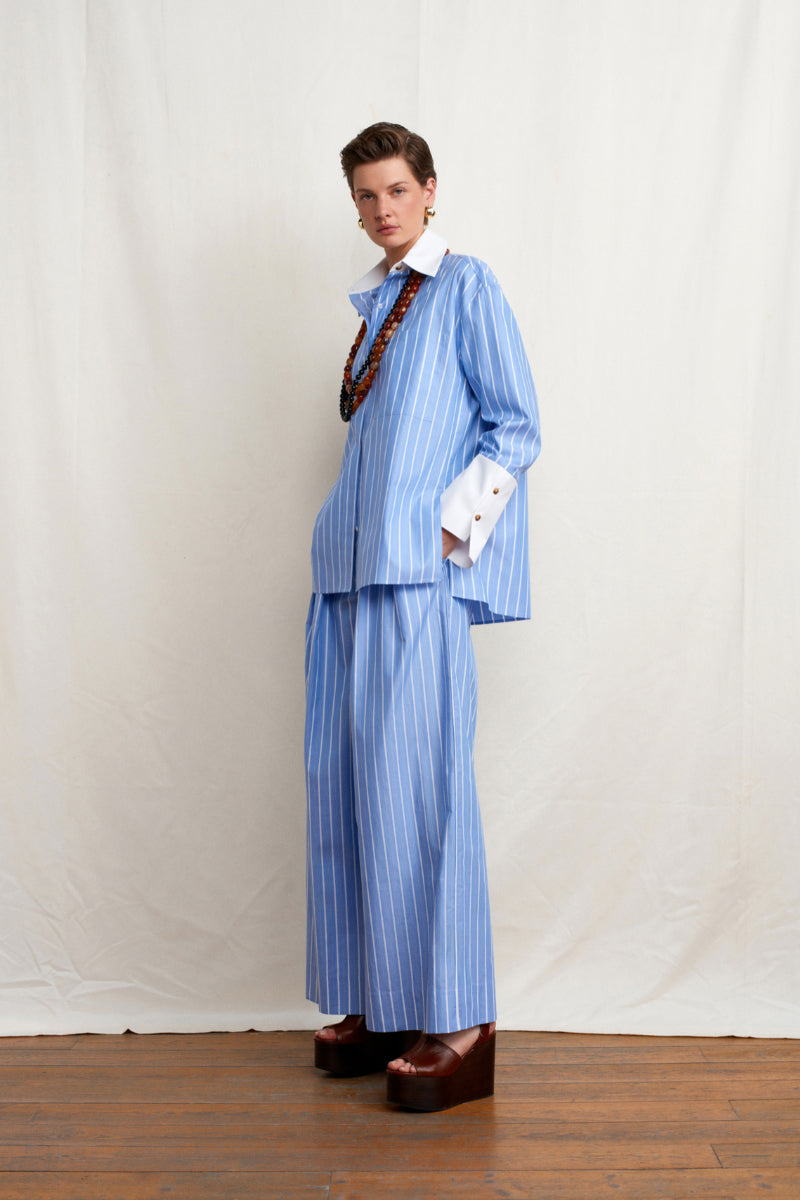 Blue Soulmate shirt by Acaria Studio, shown on a hanger with detailed fabric texture and classic collar design.