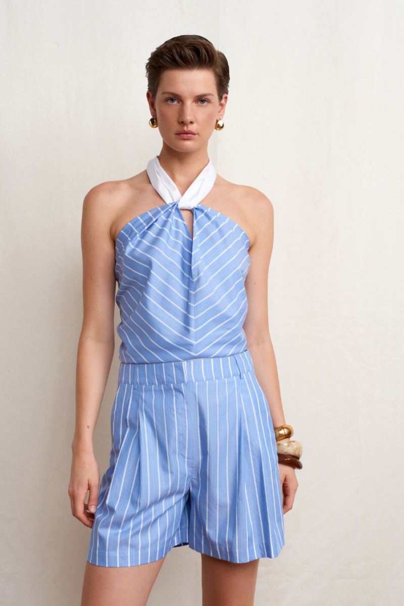 Blue Acaria Studio Soul Top, stylish sleeveless blouse with a relaxed fit, shown on a model.