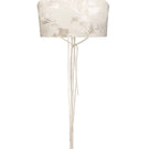 Beige Vaska crop top with short sleeves, styled casually on a hanger, showcasing its fitted design and soft fabric.