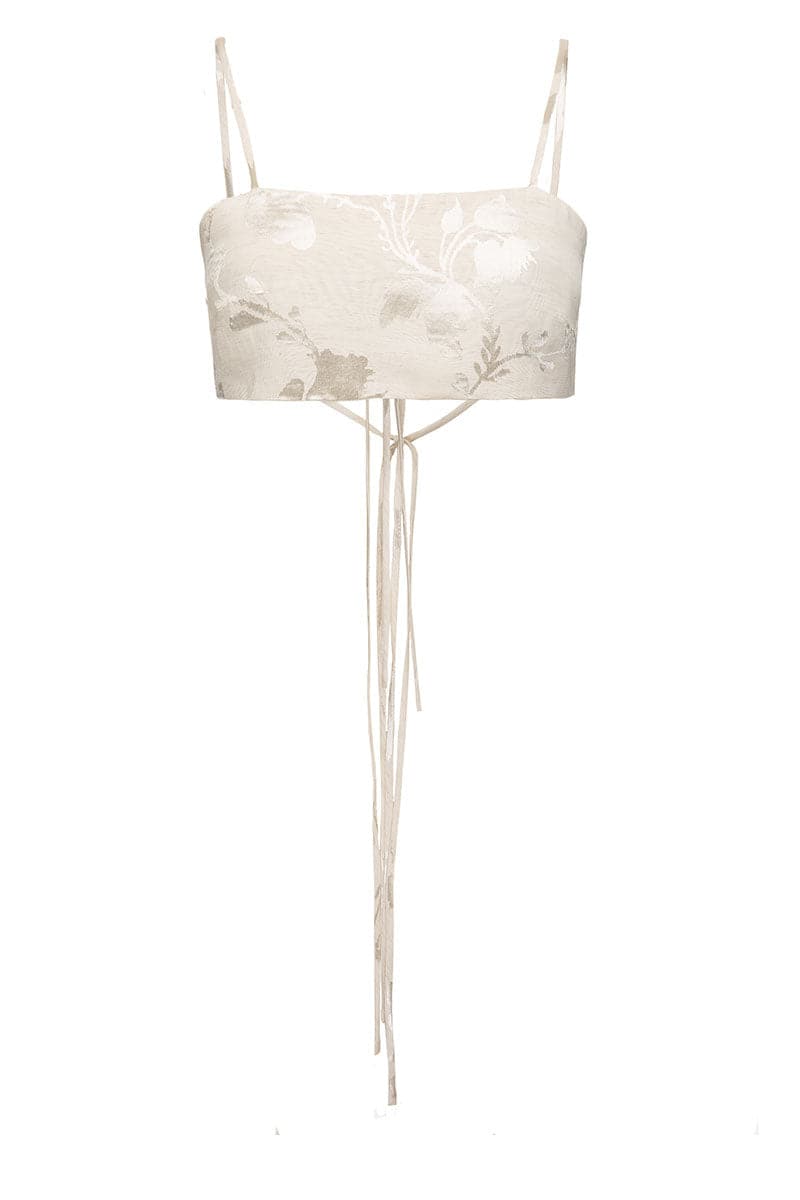 Beige Vaska crop top with short sleeves, styled casually on a hanger, showcasing its fitted design and soft fabric.
