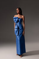 Royal blue Monika Dimova shantung gown with a bow, featuring elegant design details and flowing fabric.