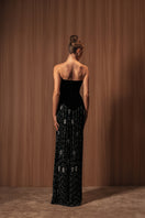 Embroidered noir velvet gown by Monika Dimova, featuring intricate embroidery and elegant flowing design.