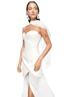 White MEA mini dress by MATTERS displayed on a hanger, showcasing its stylish design and lightweight fabric.