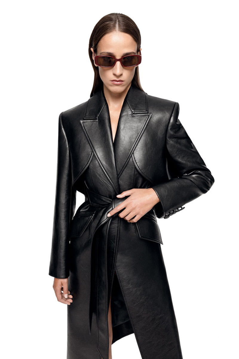 Black REIGN trench coat by MATTERS, stylish and tailored with classic lapels and button details, shown on a model.