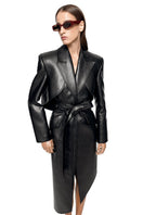 Matters Reign black trench coat hanging on a wooden hanger, showcasing sleek design and classic style.