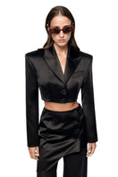 Matters LIV black blazer displayed on a hanger, showcasing a tailored fit and classic lapel design.