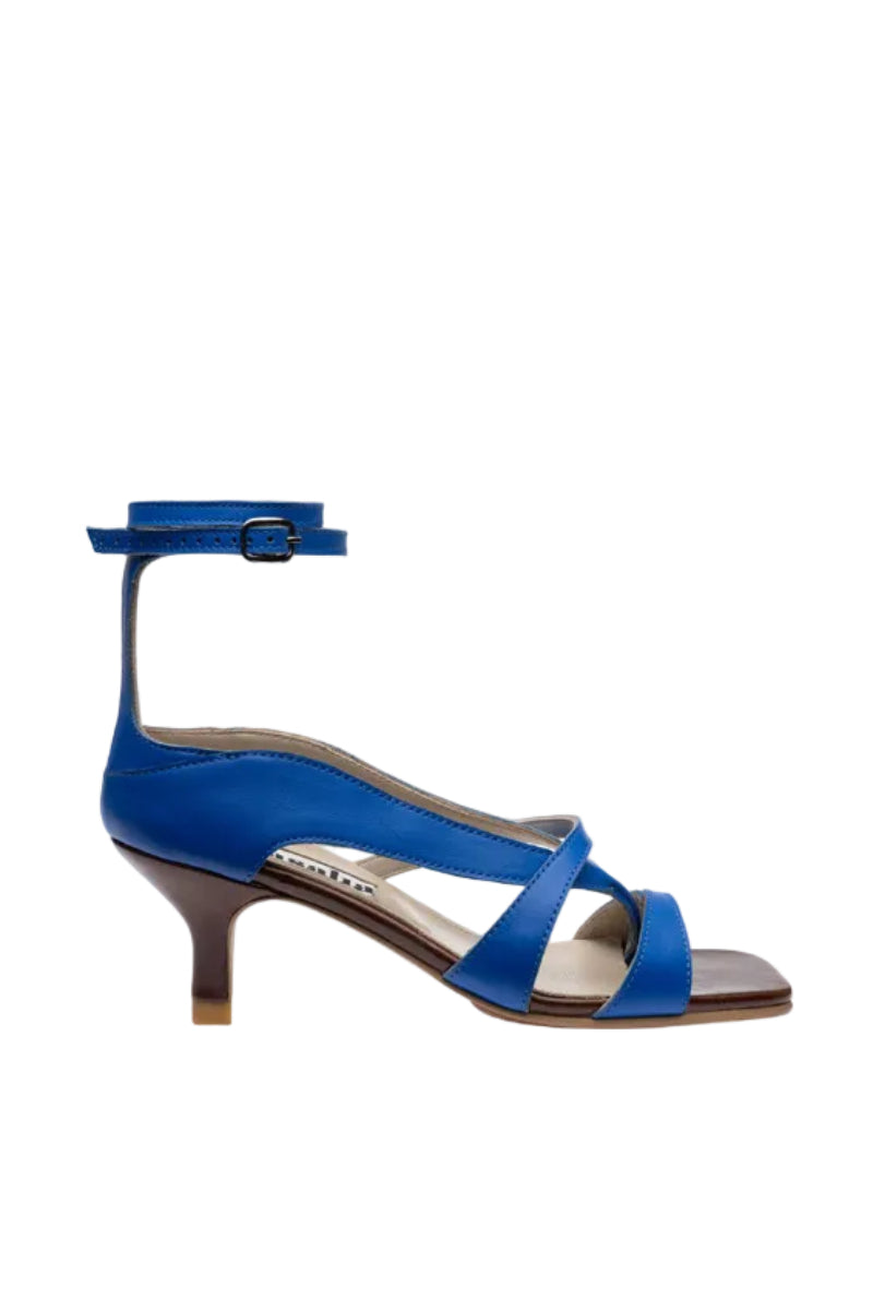 Blue asymmetric crossover heels by Gvasalia, featuring a stylish design and heel height perfect for fashionable occasions.
