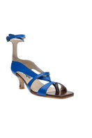 Blue asymmetric crossover heels by Gvasalia featuring stylish design and pointed toes, perfect for elegant footwear.