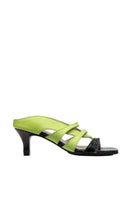 Gvasalia neon yellow asymmetric crossover heels with open toes and high stiletto heels, stylish and bold footwear for fashion-forward looks.