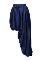 Blue draped asymmetric midi skirt by Gvasalia, featuring flowing fabric and unique design details.