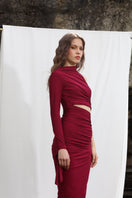 Aquarel Studio Gaia maxi dress featuring flowing fabric and a stylish design, displayed on a hanger against a neutral background.