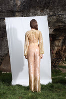 Aquarel Studio PYLA pants in a stylish, relaxed fit with a sleek design and neutral color, displayed on a hanger.