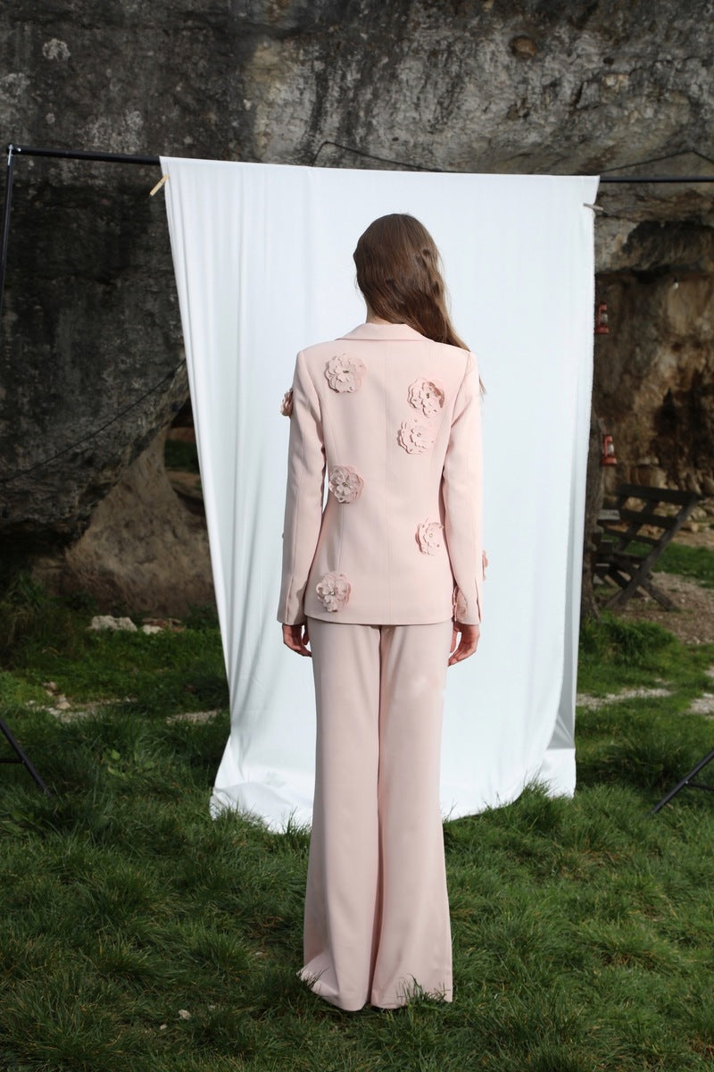 Aquarel Studio Flora Blazer, stylish tailored blazer in neutral fabric, displayed on a hanger against a plain background.