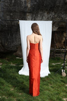Aquarel Studio Neith Tangerine top displayed on a hanger, showcasing the vibrant orange color and stylish design.