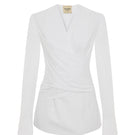 Acaria Studio Journey Shirt displayed on a hanger, featuring a casual, stylish design with a button-up front and collar.