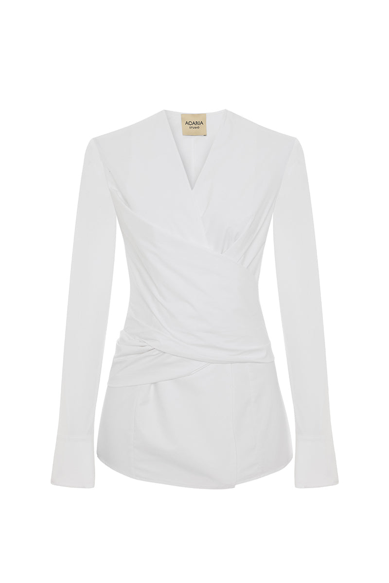 Acaria Studio Journey Shirt displayed on a hanger, featuring a casual, stylish design with a button-up front and collar.