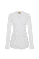Acaria Studio Journey Shirt displayed on a hanger, featuring a casual, stylish design with a button-up front and collar.
