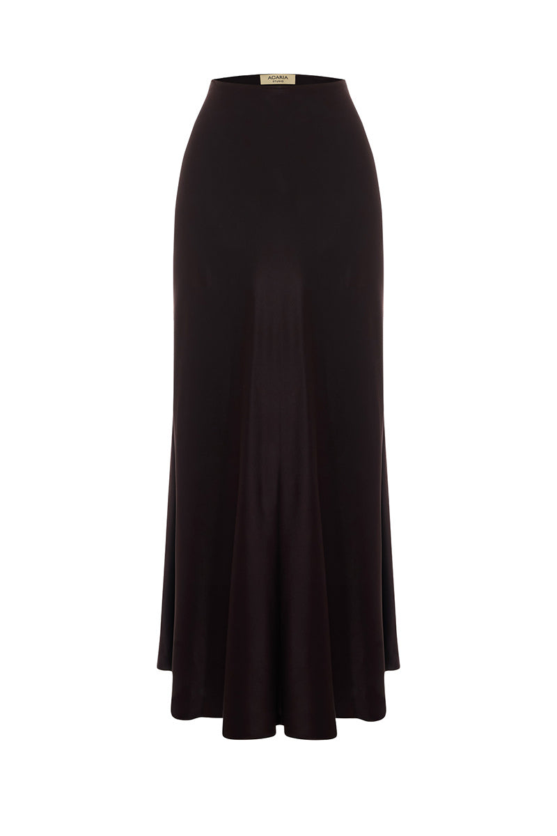 Brown satin maxi skirt by Acaria Studio featuring a flowing design and elegant waistband, styled for a sophisticated look.