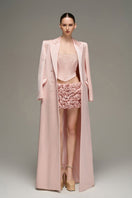 Light pink double-breasted long coat by I.H.F Studio, stylish outerwear with tailored lapels and button details.