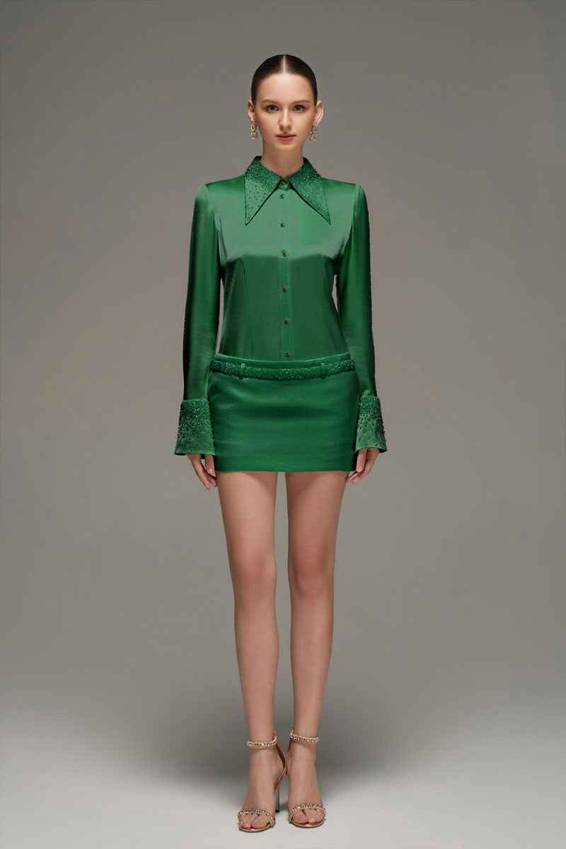 Dark green satin co-ord set featuring a stylish shirt and matching skirt from I.H.F Studio. Elegant and sleek for modern fashion.