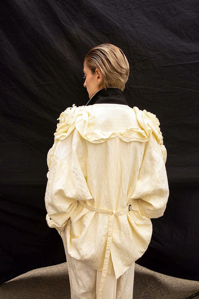 Vaska beige oversized jacket with rose embroidery, featuring a relaxed fit and stylish floral details on the front.