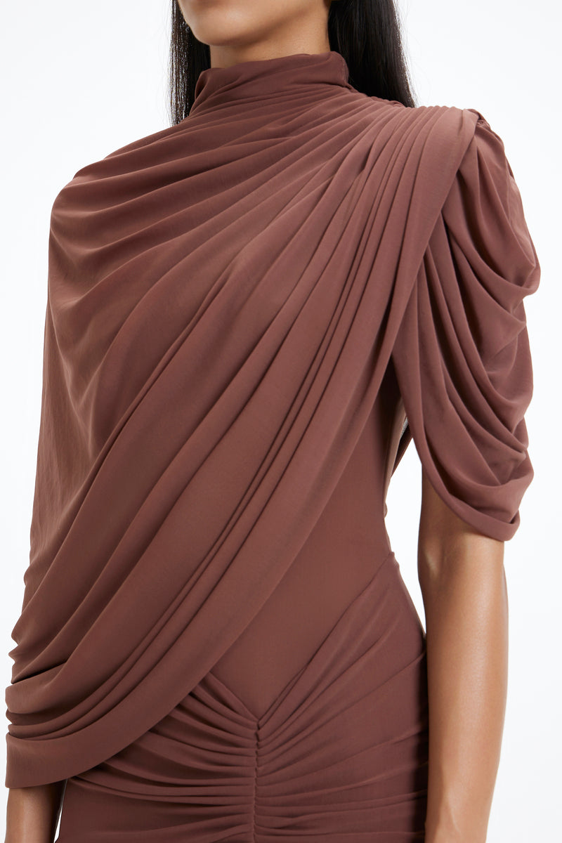 Deme By Gabriella BETH maxi dress in flowing fabric with a fitted waist and elegant design, perfect for summer or special occasions.