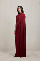 Deme By Gabriella Dianna gown in rich burgundy fabric, elegant evening gown with a flowing silhouette and detailed design.