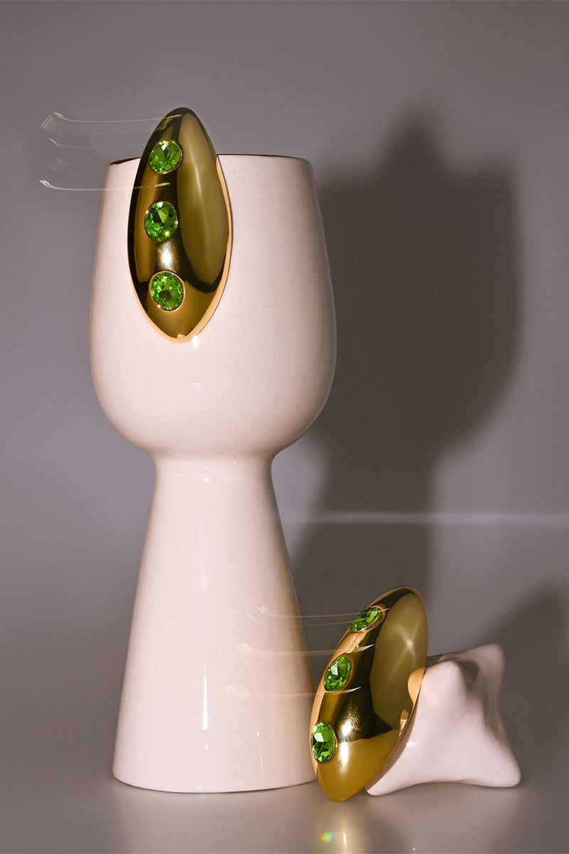 Liya Ocean Eye Green Earrings featuring vibrant green gemstone drops and silver hooks, stylish jewelry for accessorizing outfits.