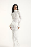 Off-white Deme by Gabriella Amber Maxi Dress displayed on a hanger, showcasing its flowing fabric and elegant design.