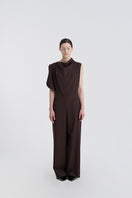 JINSUN Filante wool jumpsuit in brown, front view showing a tailored, long-sleeve design with a fitted waist and wide-leg pants.