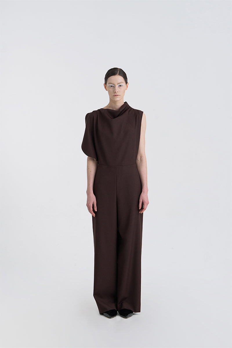 JINSUN Filante wool jumpsuit in brown, front view showing a tailored, long-sleeve design with a fitted waist and wide-leg pants.
