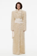 Creamy white plush fur maxi coat by Kris Marán, stylish and warm, shown on a model with a soft, luxurious texture.