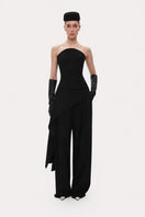 Black wide-leg wool trousers by ELENAREVA, showcasing tailored pants with a relaxed fit and smooth fabric texture.