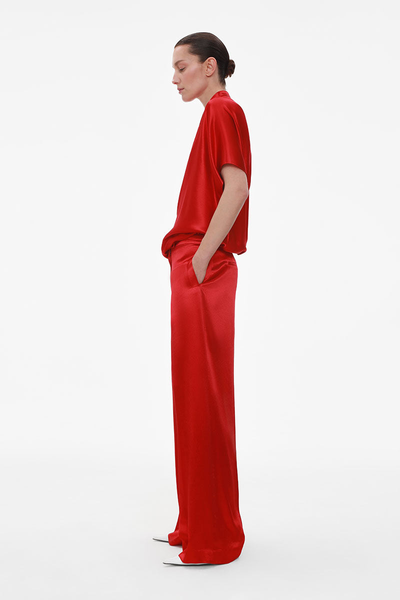 ELENAREVA red wide-leg viscose trousers, stylish pants with a relaxed fit and flowing fabric, shown on a model.