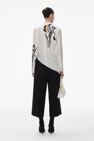 Black wool culottes pants with silk belt by ELENAREVA, featuring wide-leg design and stylish waist detailing.