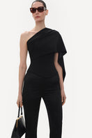 Black slim satin trousers by ELENAREVA, showcasing smooth fabric and tailored fit in a stylish pair of pants.