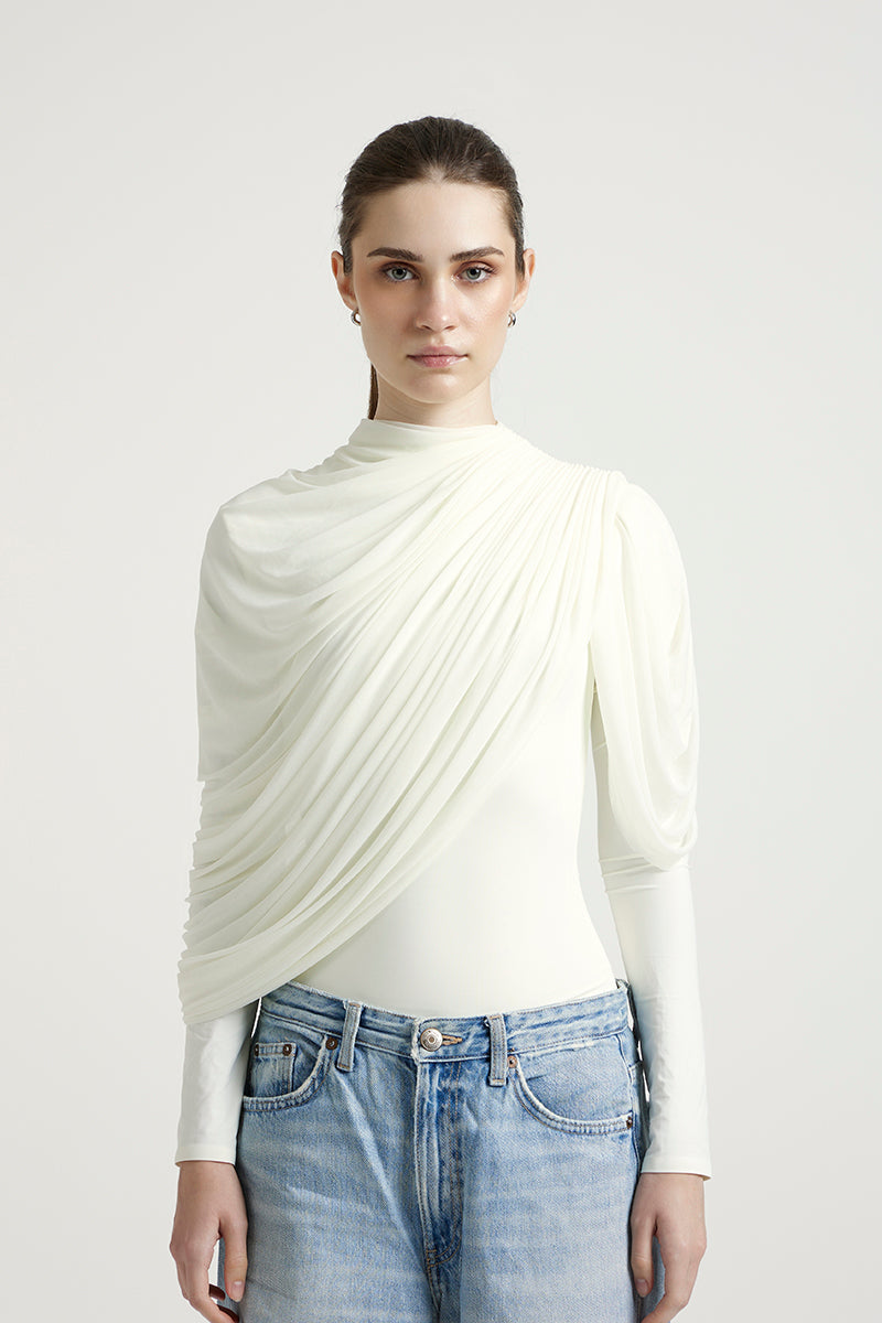 Deme By Gabriella Lisbeth top in off-white, casual sleeveless sleeveless blouse with a relaxed fit, displayed on a hanger.