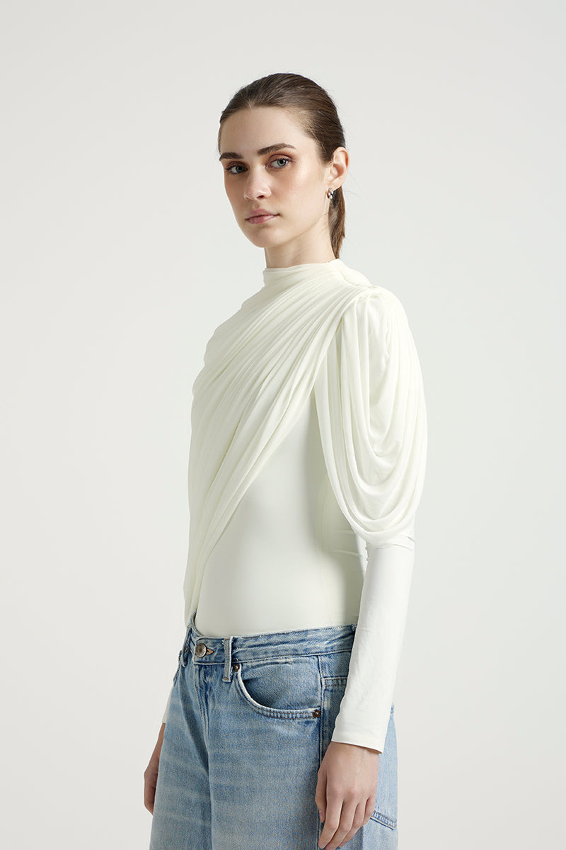 Deme By Gabriella Lisbeth off-white top, featuring a stylish design and soft fabric, perfect for casual or dressy occasions.