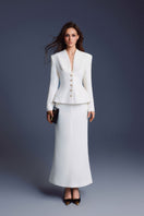 White folded buttons top by Keira Tong, featuring a stylish design with folded details and button accents.
