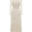 White Plan blush feather romance gown with flowing fabric and delicate feather details, perfect for elegant occasions.